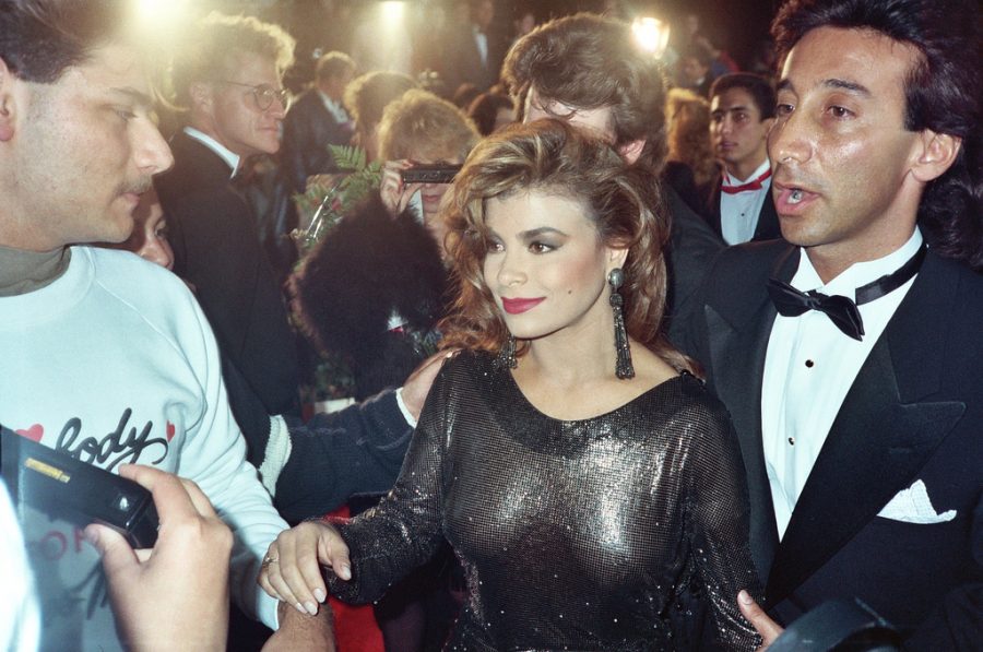 Being escorted to the Academy Awards, Paula Abdul is excited for the show. 