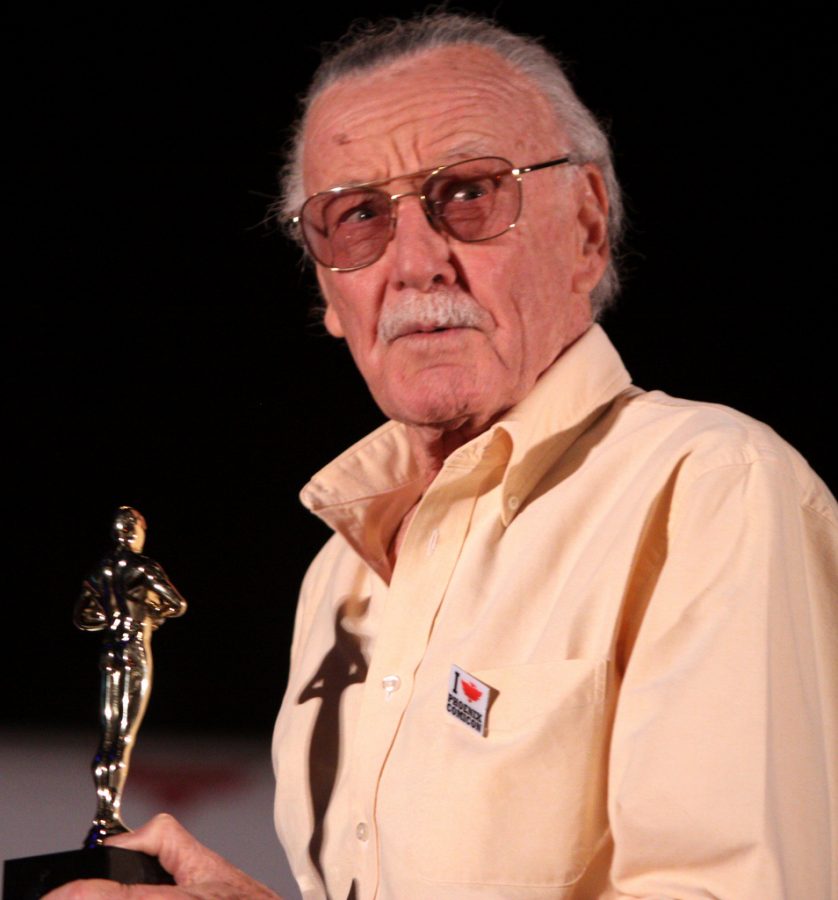 Proud of his accomplishments, Stan Lee accepts an award. 