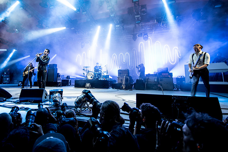 Singing for their fans, Arctic Monkeys perform at the Orange Stage Roskilde Festival. 