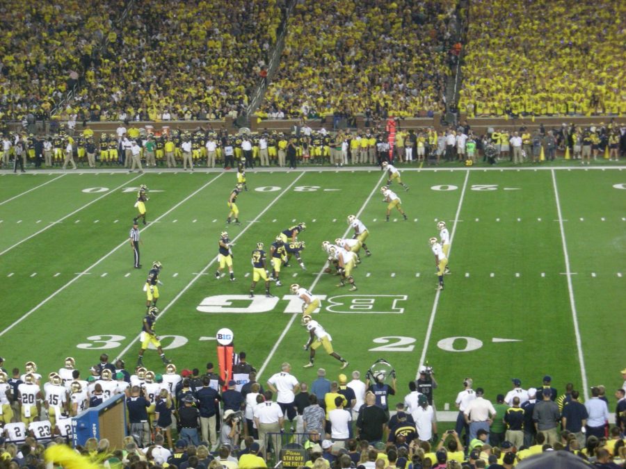 Seen here on the right side, is the Notre Dame offense going up against the Michigan defense on the left side of the photo.