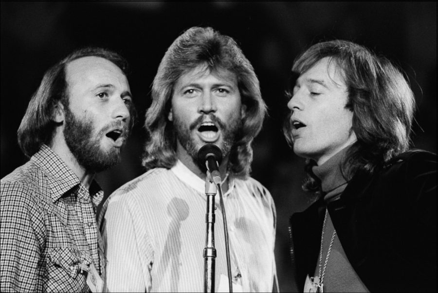 Singing Staying Alive, The Bee Gees, perform for the soundtrack Saturday Night Fever.