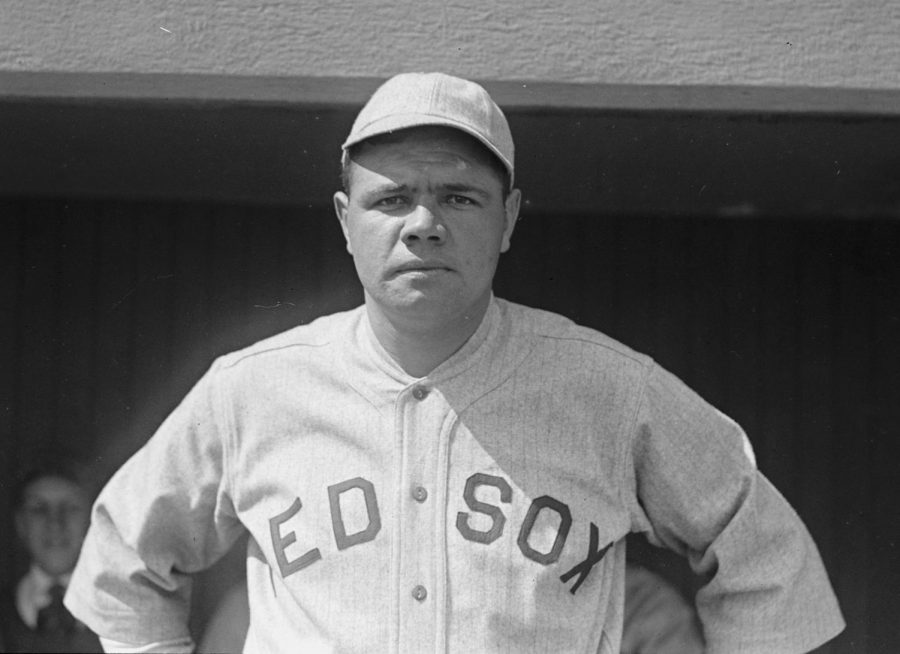 Seen here is MLB icon Babe Ruth in a Boston Red Sox jersey, who were unable to win a World Series for 86 years after they traded away Babe Ruth to the Yankees.