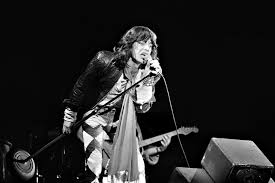 Engaging with the audience, Mick Jagger, performs at the concert as a solo artist. 