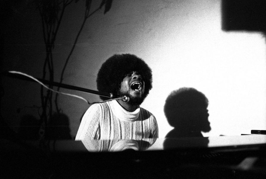 Passionately singing to one of his songs, Billy Preston plays the keyboard. 