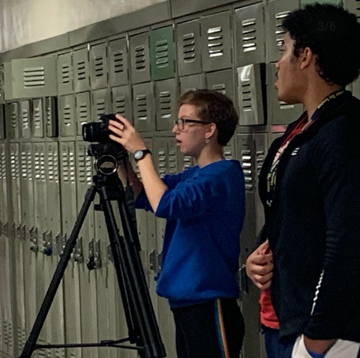 Filming a scene for their PSA, student Rachel Sowinski, aims to get the perfect shot. 