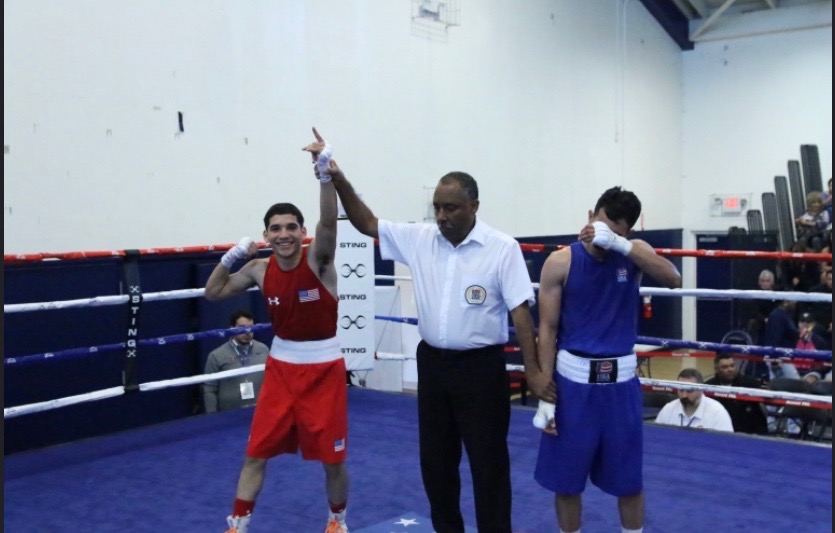 Jose  strikes a pose after his victory against his opponent 