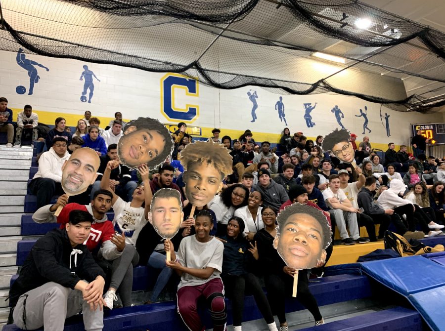 To motivate the Colonia Varsity Boys Basketball team, the Colonia Crazies brought fat heads.