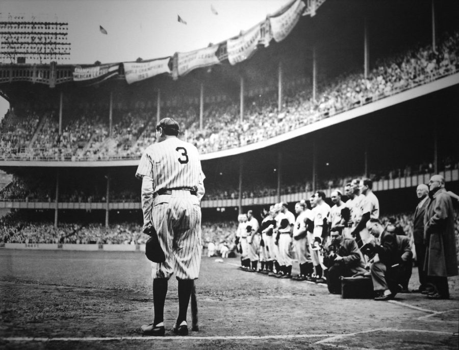 Babe Ruth appearing in front of thousands of fans at the Yankee Stadium.