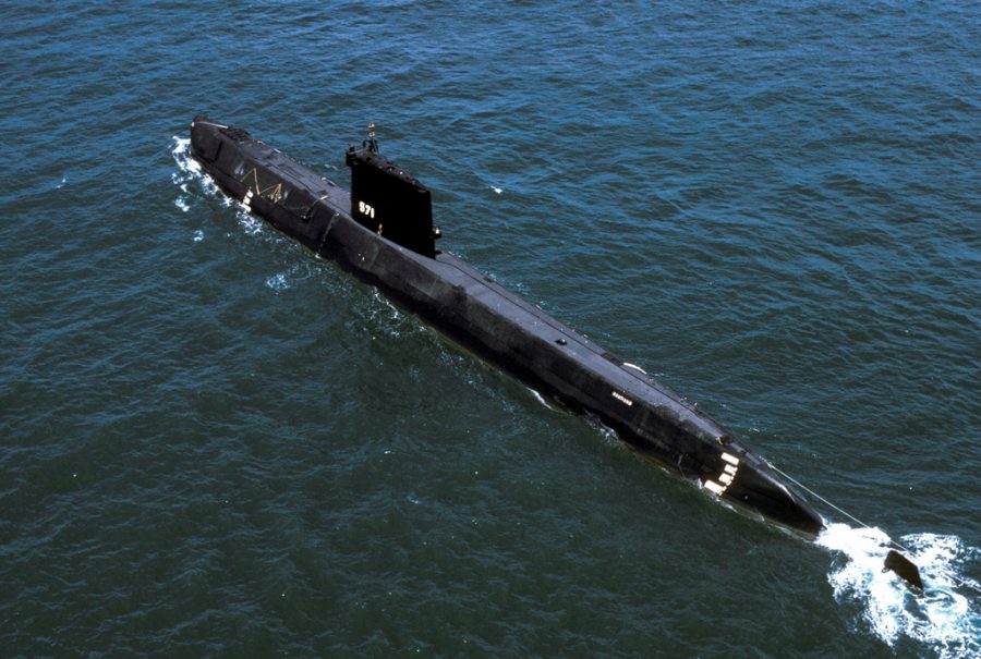 An aerial port quarter view of the nuclear-powered attack submarine ex-USS NAUTILUS (SSN 571).  The NAUTILUS is being towed to Groton, Connecticut, where it will become a museum.