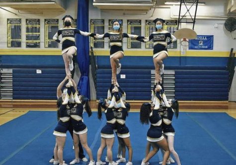 Performing a routine is Colonia High Schools competition cheer team. Doing stunts like that requires much athletic ability, so its important to stay in shape.