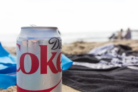 Pictured is a traditional can of Diet Coke. Cans of this type of soda can float when submerged in water. 