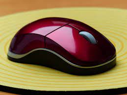 Pictured is a red computer mouse. Theyre measured in a unit of mickeys.