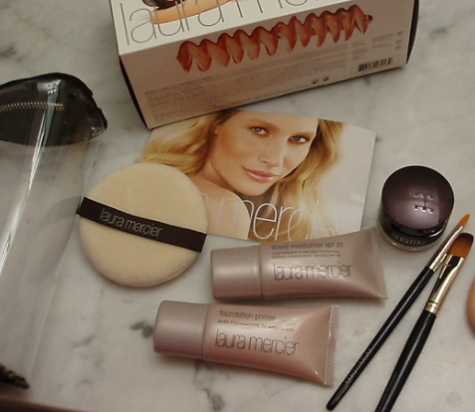 Picture of Laura Merciers 2010 tinted moisturizer, foundation primer, and powder puff. Her updated gift sets include similar products.