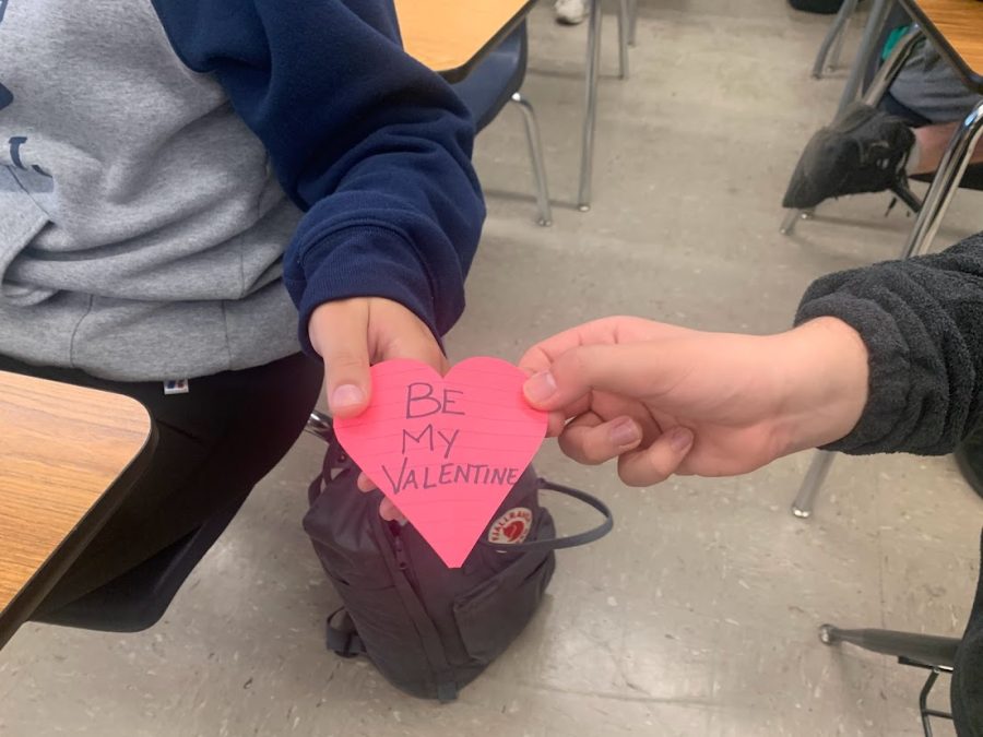 Although the days of passing notes during class is over,  you can still find ways to let someone know you are interested in them while at school.  Eye contact, giving them your full attention, and giving them your number are just a few ways to drop hints that you are into them.