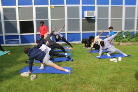 One activity students participated in at the mental health fair was yoga to improve strength and breathing.