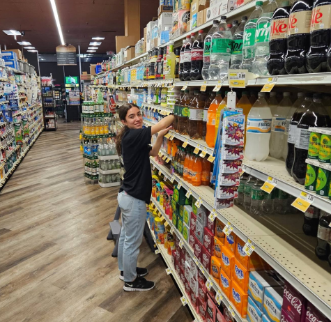 Stocking shelves at Fresh Grocer, Daniella Albuquerue, 16, is only allowed to work a few hours at her job in New Jersey due to child labor laws.