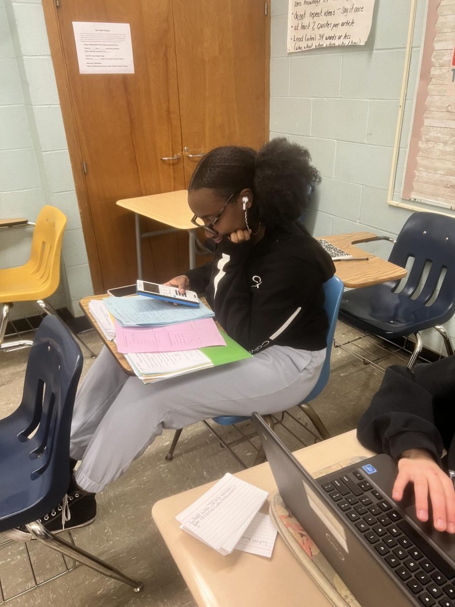 Junior Gabryelle stressing as she studies her chemistry homework 
