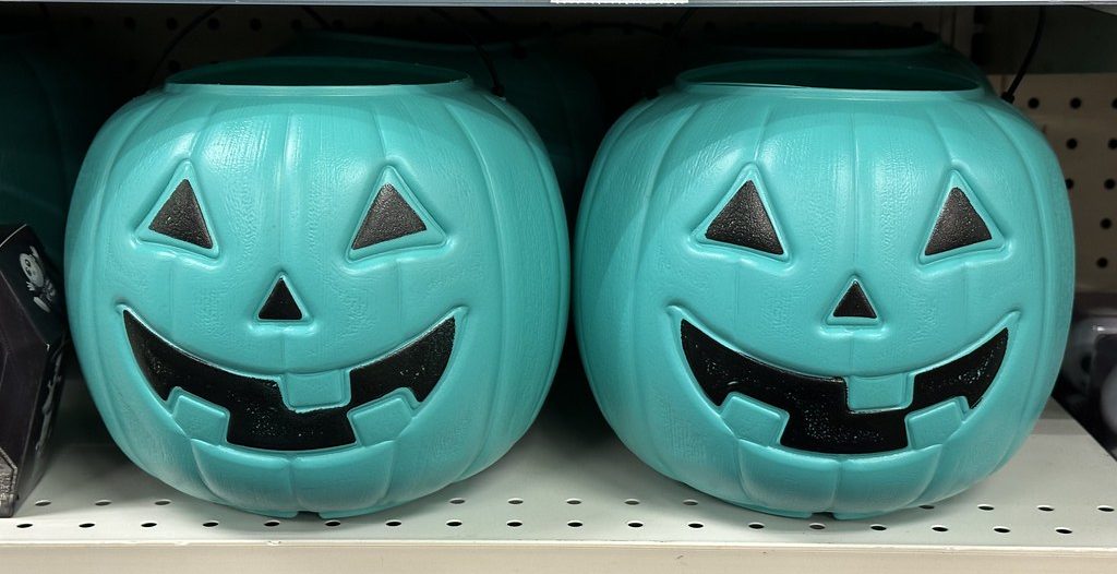 Some children may carry a colored pumpkin to make homeowners aware of their circumstances. However, some homeowners may put a colored pumpkin on their stoop to let trick or treaters know it is safe to get treats here.