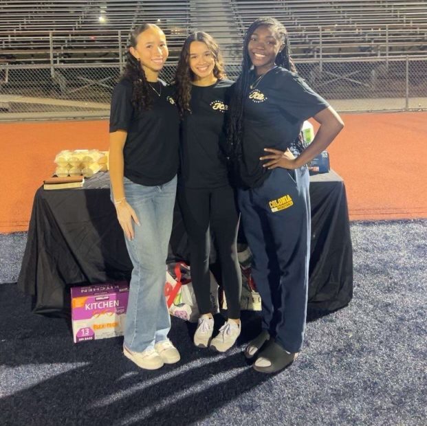 At the Fields of Faith event in October, Jennie Ramirez, Daniella Barros, and Izzy Gidado assist with the turn out of athletes on Colonia football field. The event first started in 2004 and 20 years later, it was held on Colonia's blue turf.