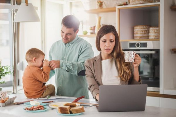 Working mother works from home while manages a busy life with a child and husband. 