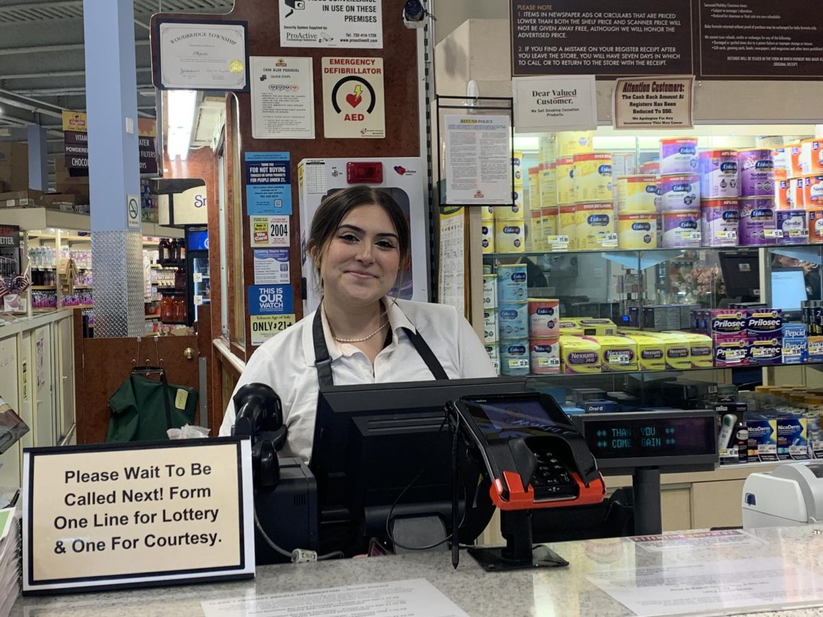 At the customer service counter, Daisy Amaya prepares to assist Shoprite customers with lottery purchases and rain checks.