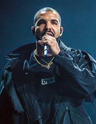 Canadian rapper and singer Drake commands the stage during the "It's All A Blur" tour, captivating a packed audience with his extensive catalog of hits. The influential artist is known for his high-energy shows and for pushing the boundaries of modern hip-hop.