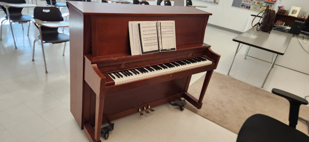 A little boy exploring the art of the piano, learning notes and figuring out how to put them togther to create a beautiful melody.