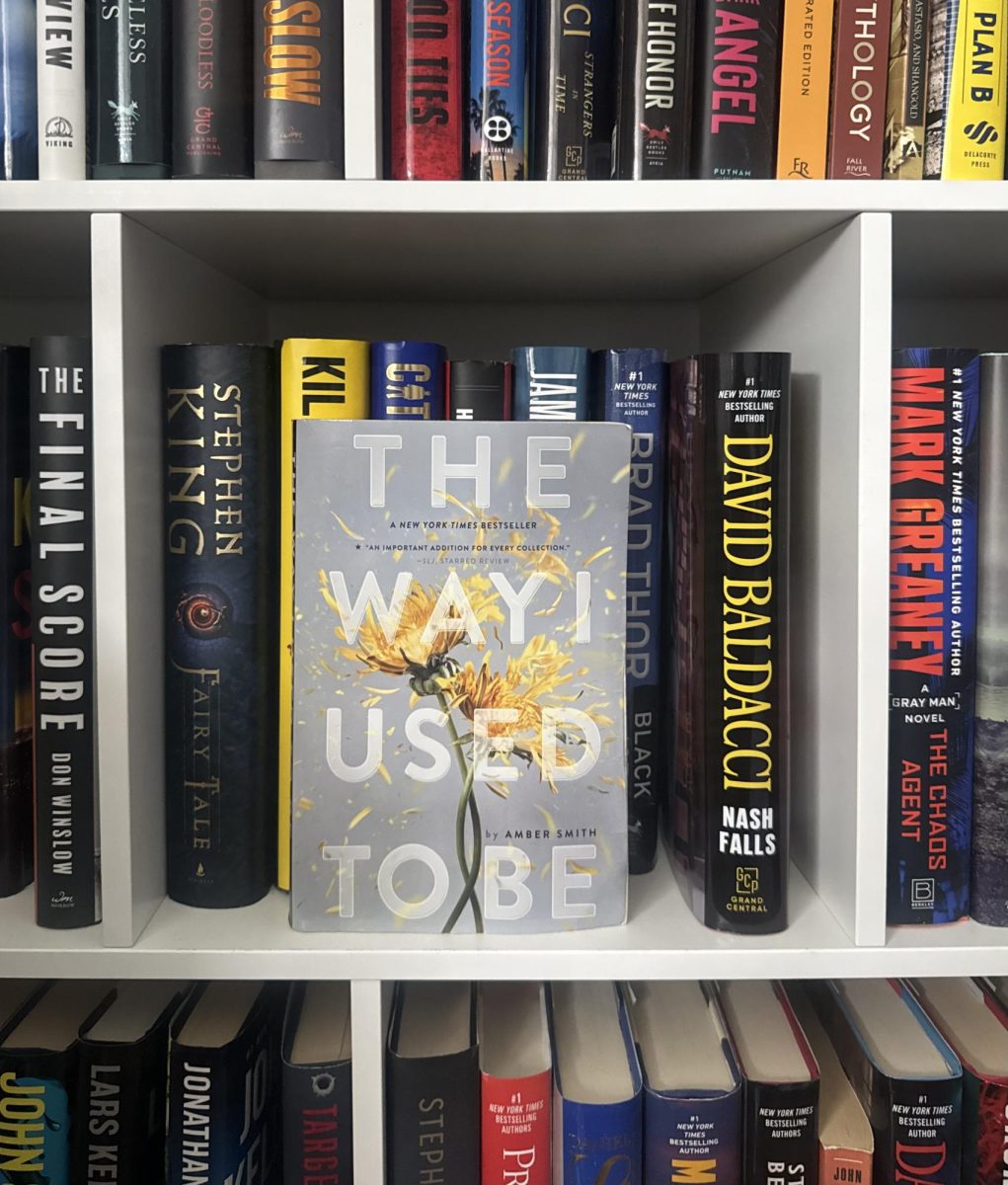 The Way I Used to Be by Amber Smith stands out on a full bookshelf. The Way I Used to Be is ready to be picked up and enjoyed by its next reader. 