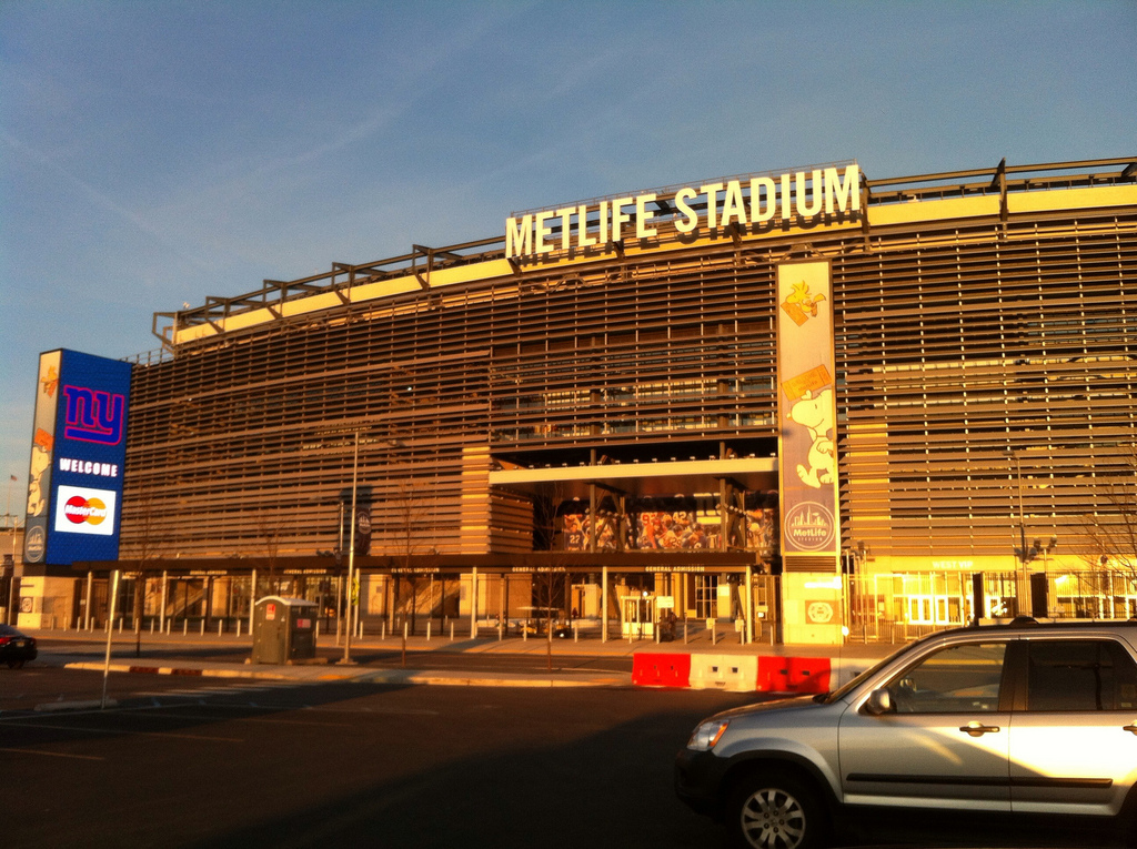 The exterior of Metlife Stadium in East Rutherford, New Jersey glows during sunset.