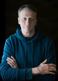 Became a pro at 14, won 73+ contests, and became the first to land the "900" in 1999. Born in 1968, he revolutionized vertical skating, invented over 100 tricks, built a massive video game empire, and runs a foundation that has funded over 900 public skateparks.