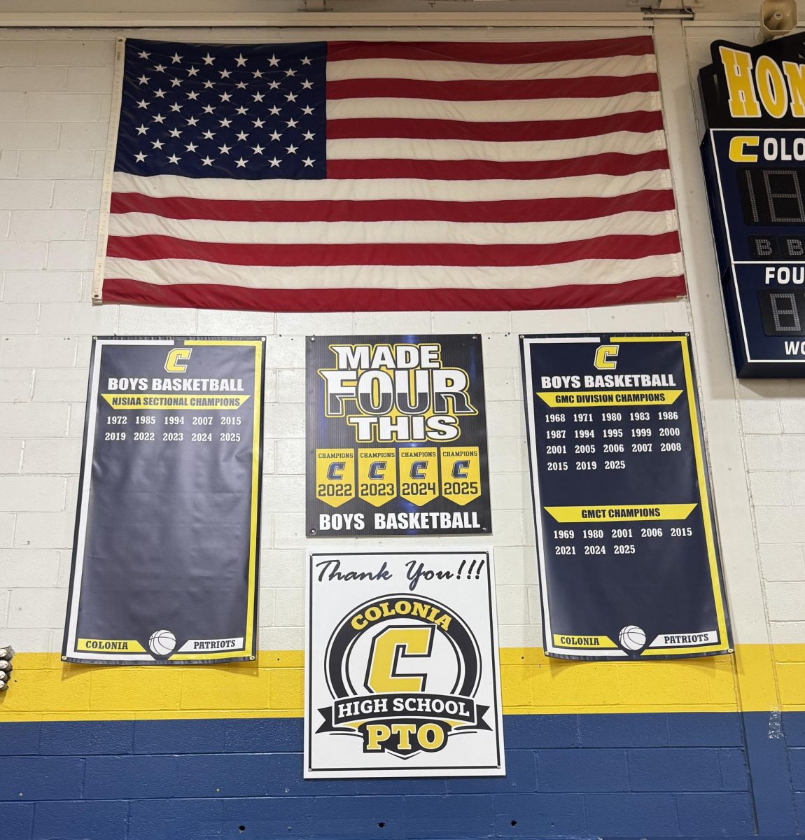 The Colonia Boys Basketball banners hang, waiting to be updated. The made four this sign should change to made five this after this years sectional championship. 