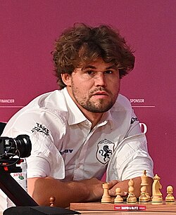 Magnus Carlsen is a Norwegian chess prodigy who became the highest-rated player in history ((2882)) and the first to win all three FIDE titles (Classical, Rapid, Blitz) simultaneously. Nicknamed "the Mozart of Chess," he dominated as World Champion from 2013–2023, is a skilled poker player, and once topped the global fantasy football rankings.